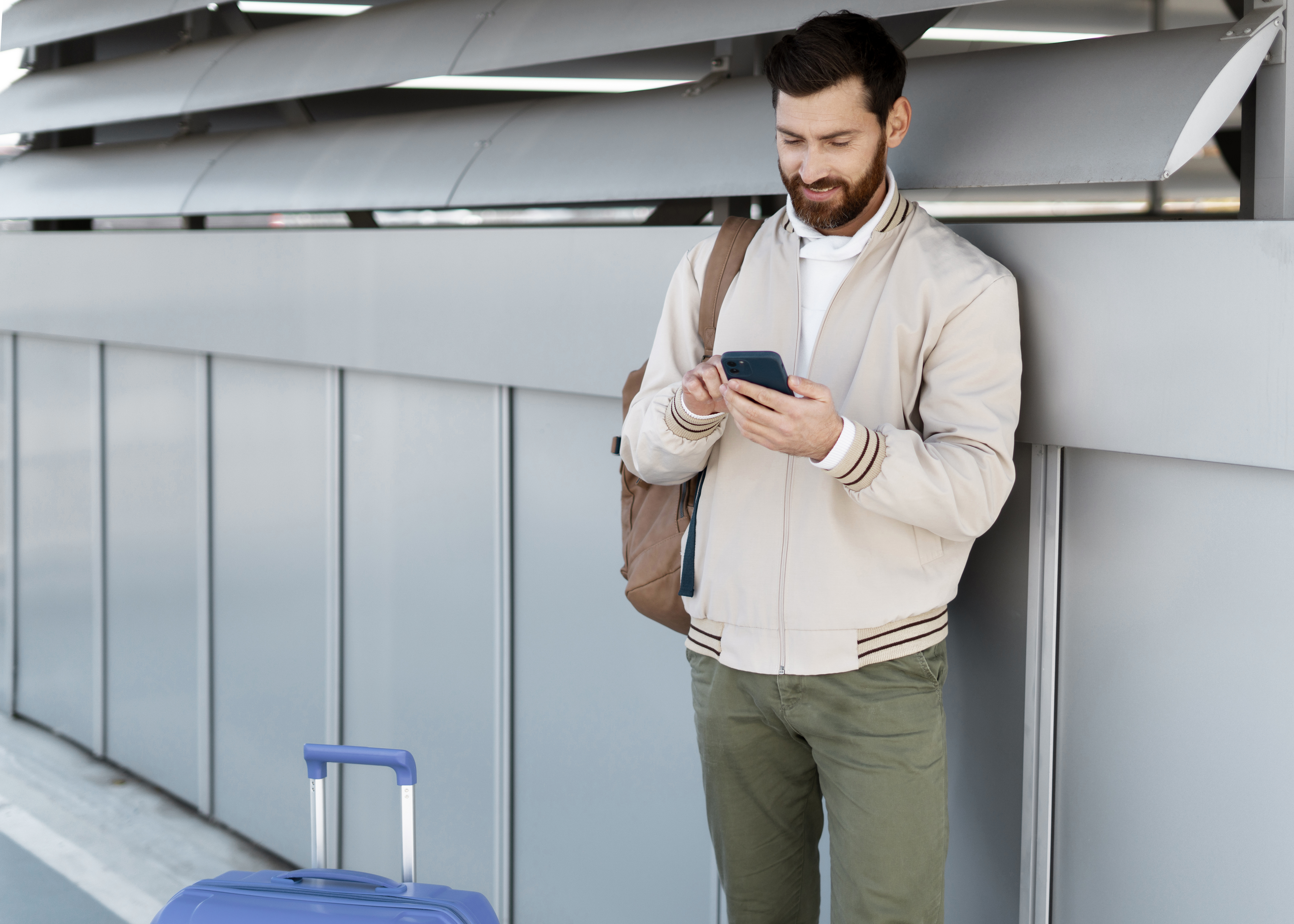 medium-shot-man-holding-smartphone