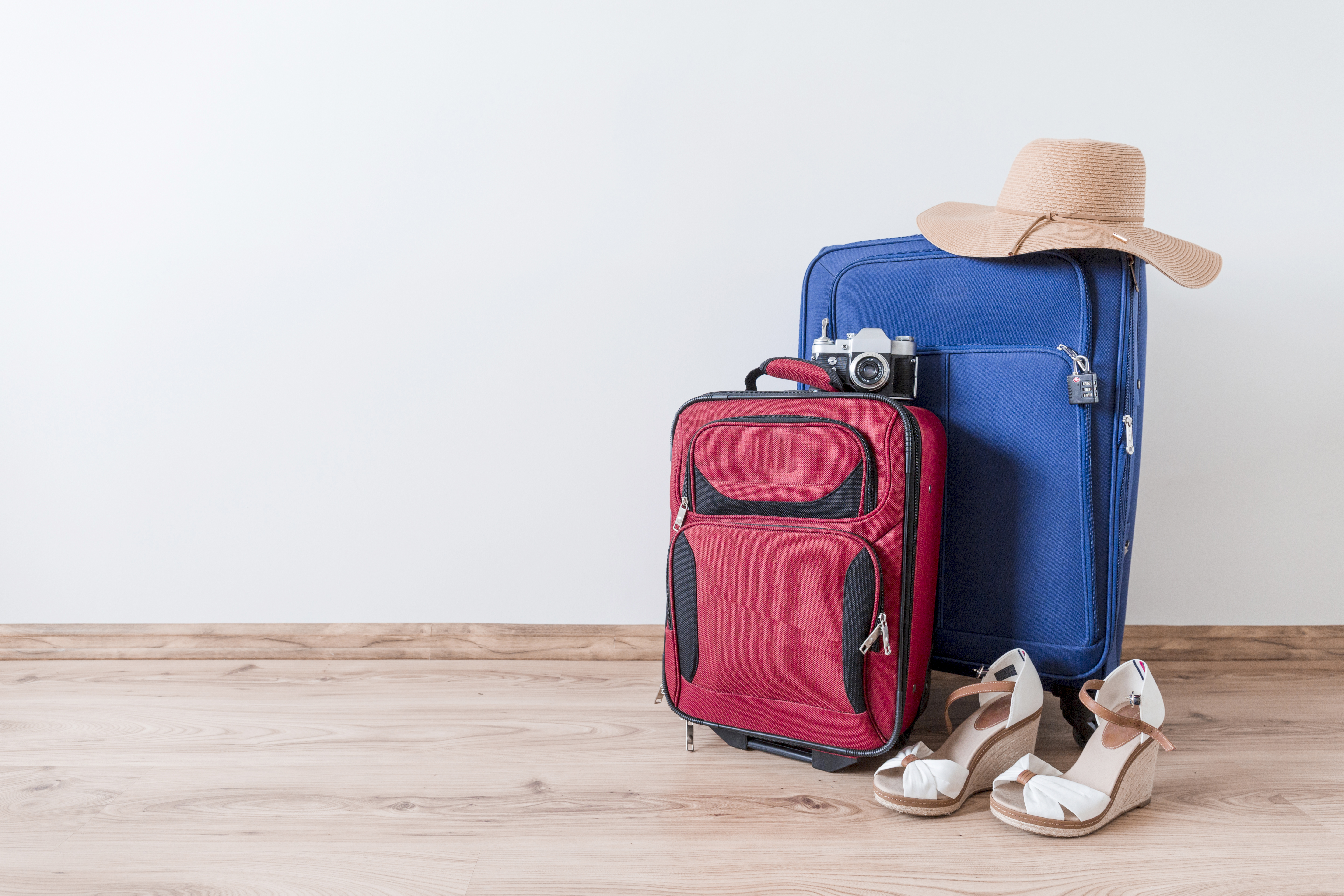 peep-toe-shoes-hat-near-suitcases-camera